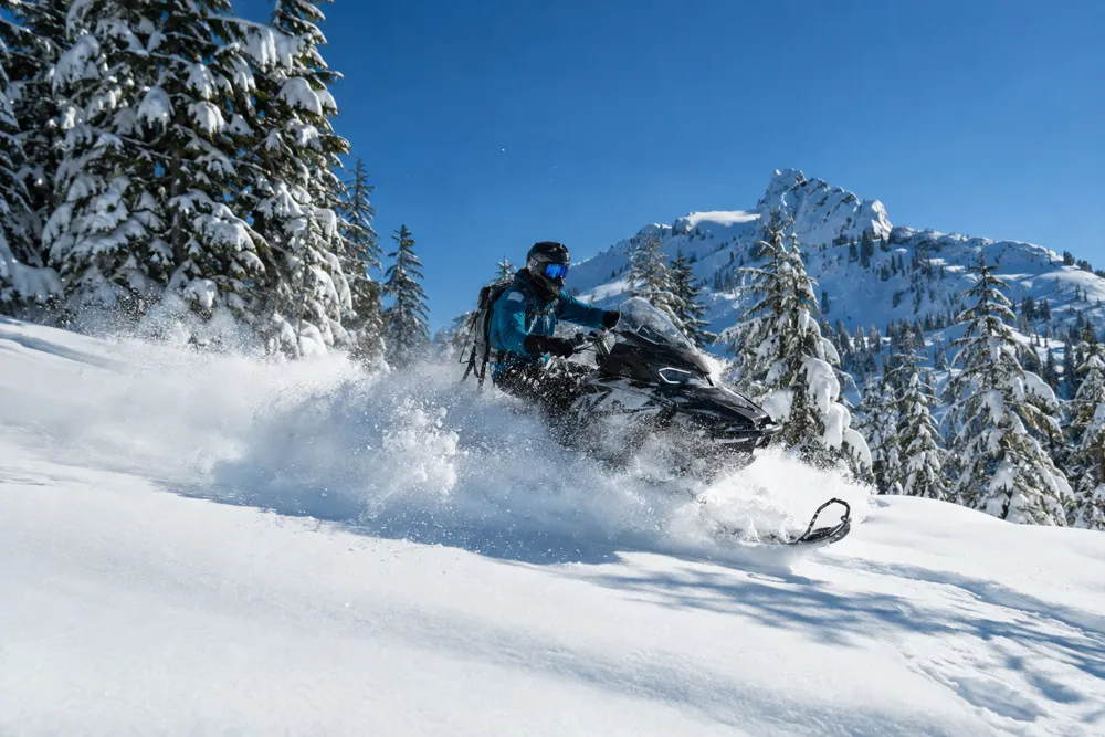 Snowmobile in fresh powder